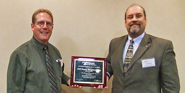 ODOT's representative accepting the ITS Midwest Award for the Freeway Management System - Traffic Management Center
